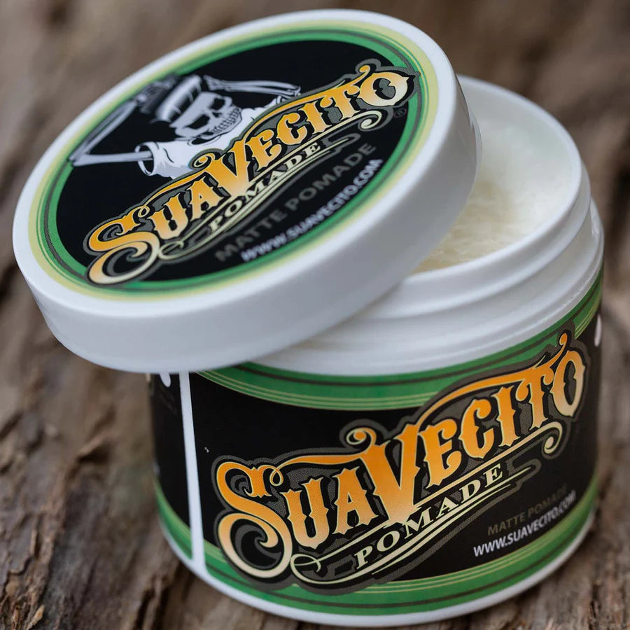 Suavecito matte pomade jar with green-and-white lid, open top visible