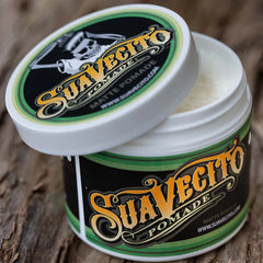 Suavecito matte pomade jar with green-and-white lid, open top visible