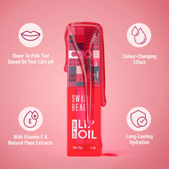 Dip tint lip oil bottle with clear applicator wand and glossy red-pink tint