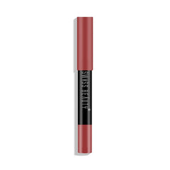 Matte lip crayon in dusty peach-pink, cylindrical tube with black label band