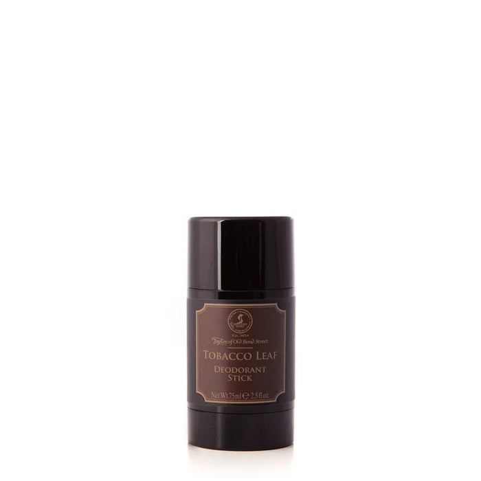 Tobacco leaf deodorant stick in dark cylinder with gold label, black cap