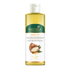 Argan oil hair oil bottle with gold cap, amber liquid