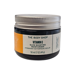 Vitamin C glow boosting moisturiser jar, orange label, silver lid