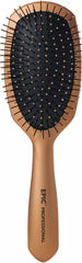 Paddle hair brush with dark bristle pins and tan handle, ergonomic grip.