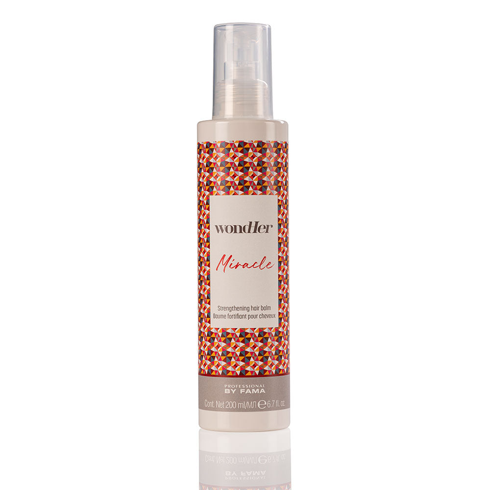Hair balm bottle with pump, patterned label and clear plastic dispenser