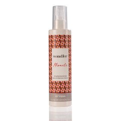 Hair balm bottle with pump, patterned label and clear plastic dispenser