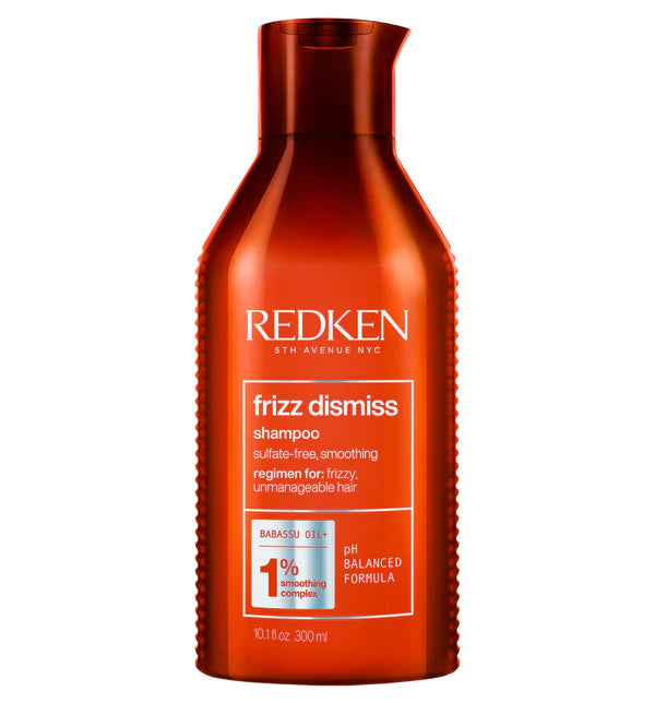 Redken Frizz Dismiss shampoo bottle, 300 ml, orange-red with label