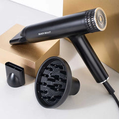 Black hair dryer with diffuser and nozzle attachment shown