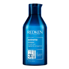 Redken Extreme shampoo bottle, blue plastic with dark cap and white label
