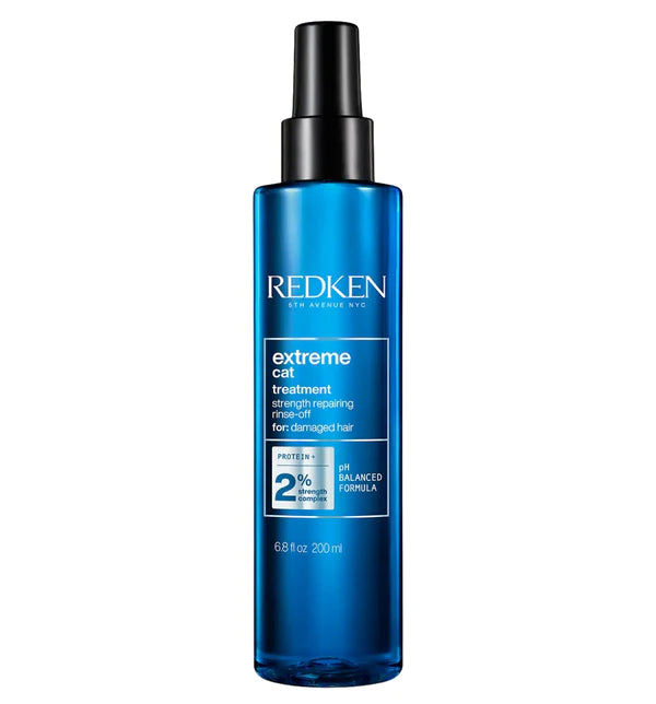 Blue hair treatment bottle with black pump, Redken Extreme CAT treatment label