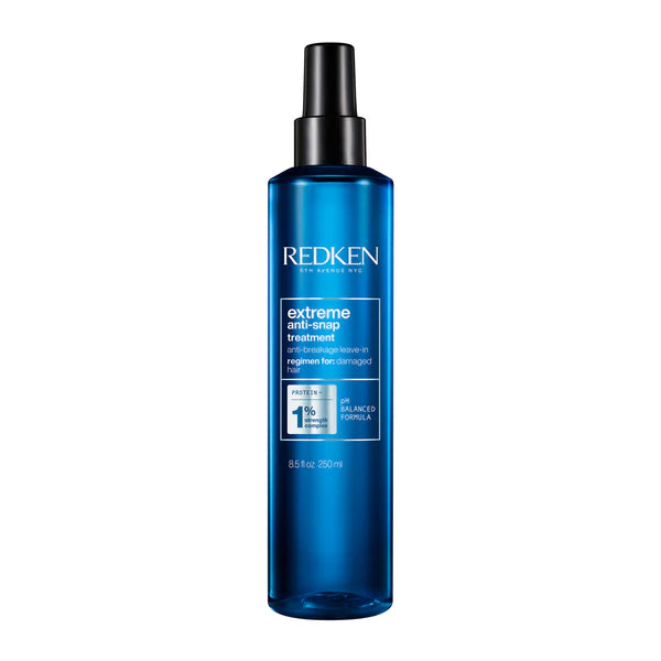 Redken Extreme anti-snap treatment bottle, blue glass with black pump cap