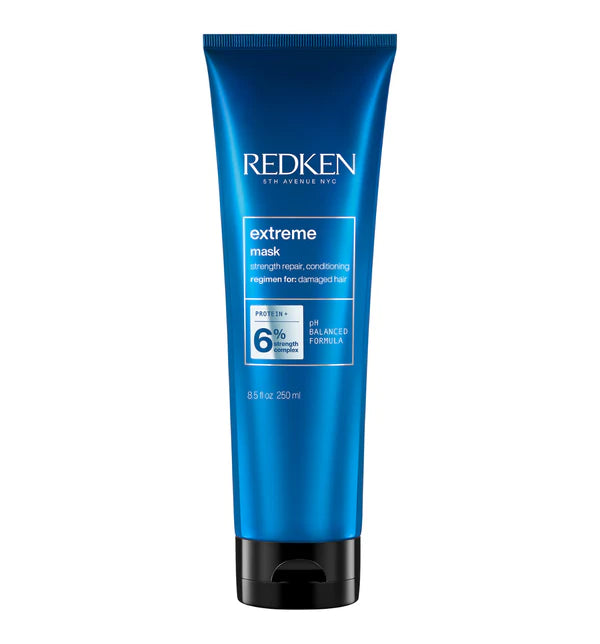 Redken Extreme mask hair treatment in blue squeeze tube, black cap and nozzle