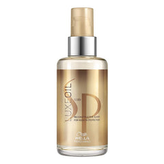 Wella SP Luxe Oil reconstructive elixir bottle with gold pump and clear glass