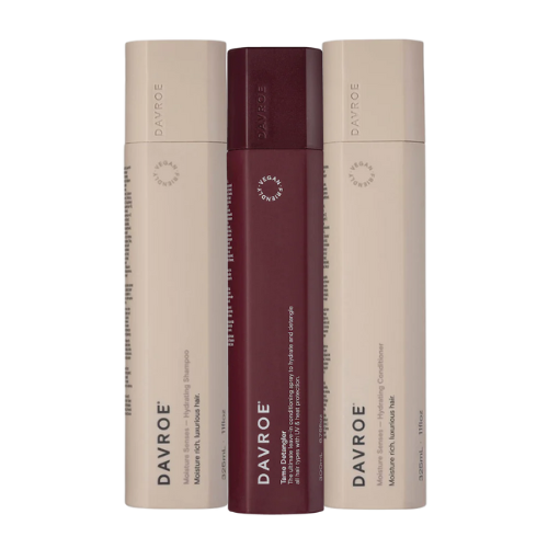 Davroe detangler trio bottles: two beige and one plum