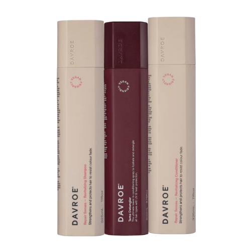 Hair detangler trio bundle with three cylindrical bottles, two beige and one maroon, Davroe branding