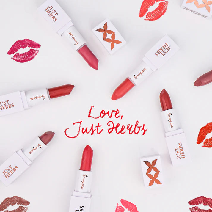 Multiple pink mini lipsticks with white brand boxes arranged on a flat surface