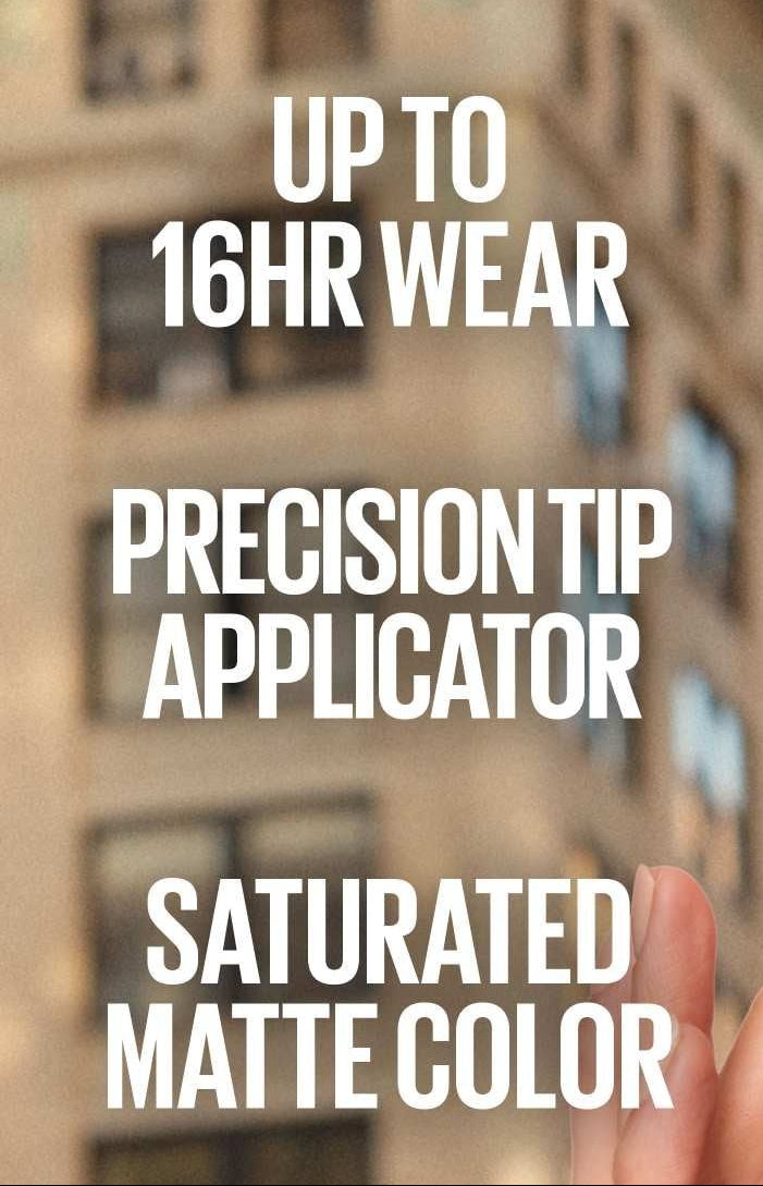 Matte liquid lipstick applicator near lips with a saturated pink finish