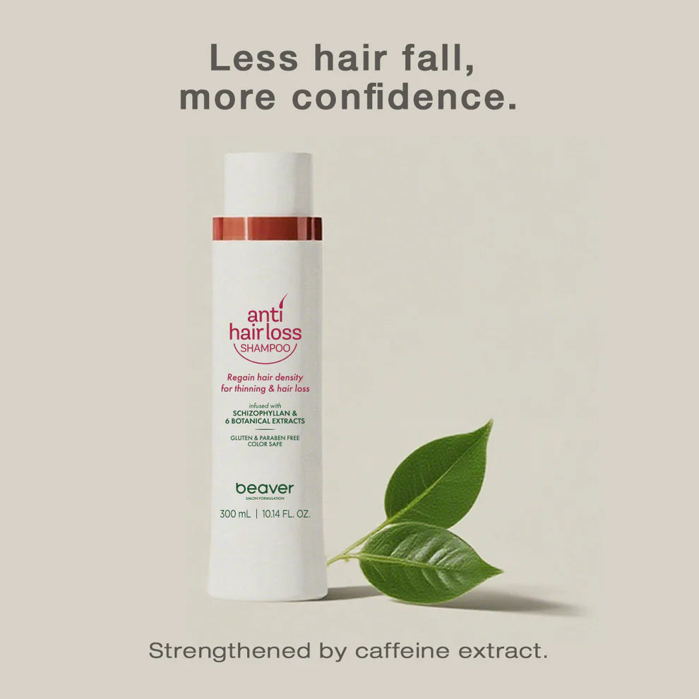 Anti-hair-loss shampoo bottle with red band and leaf beside it