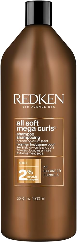 Amber-brown shampoo bottle with REDKEN branding and All Soft Mega Curls label