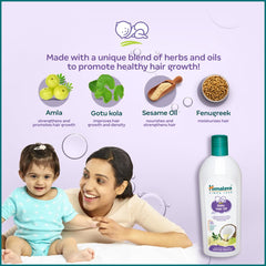 Himalaya Baby Hair Oil bottle with herb and grain illustrations.