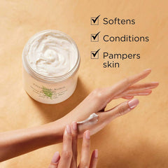 Body cream on hands with small jar, thick glossy white cream