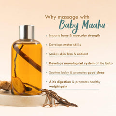 Baby massage oil bottle with silver cap, teal label, and amber oil with roots