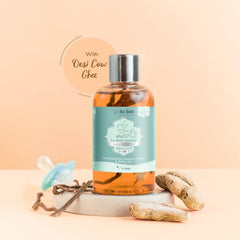 Baby massage oil bottle with silver cap, teal label, and amber oil, 50 ml