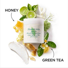 Body cream jar with white lid, beside green tea leaves, lime and honeycomb
