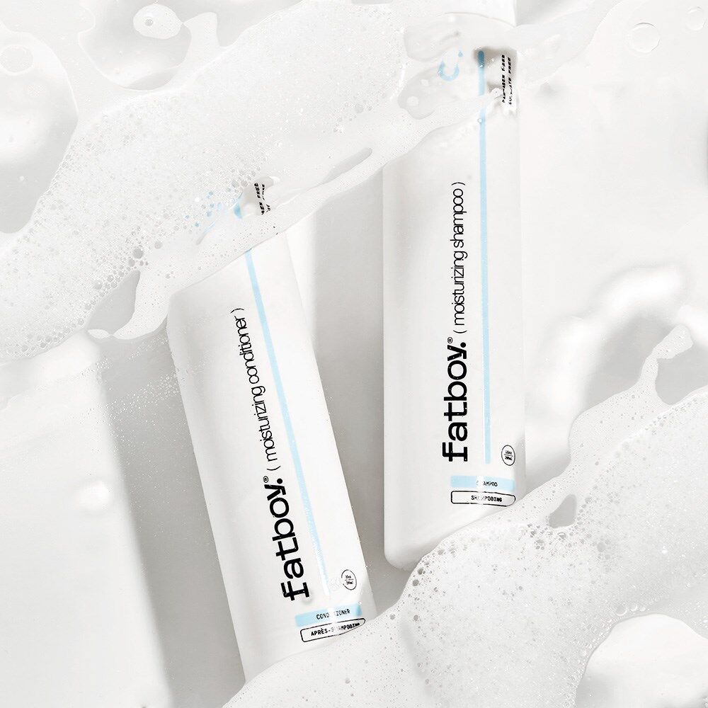 Fatboy moisturizing shampoo bottles in white foam, two-pack view