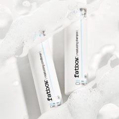 Fatboy moisturizing shampoo bottles in white foam, two-pack view