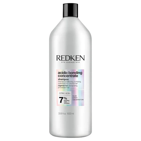 Shampoo bottle with black cap and REDKEN label, acidic bonding concentrate text