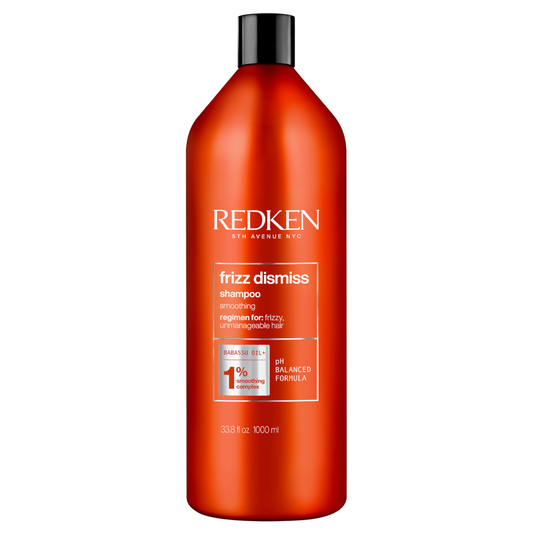 Redken Frizz Dismiss shampoo bottle, red-orange with black cap, 1 L