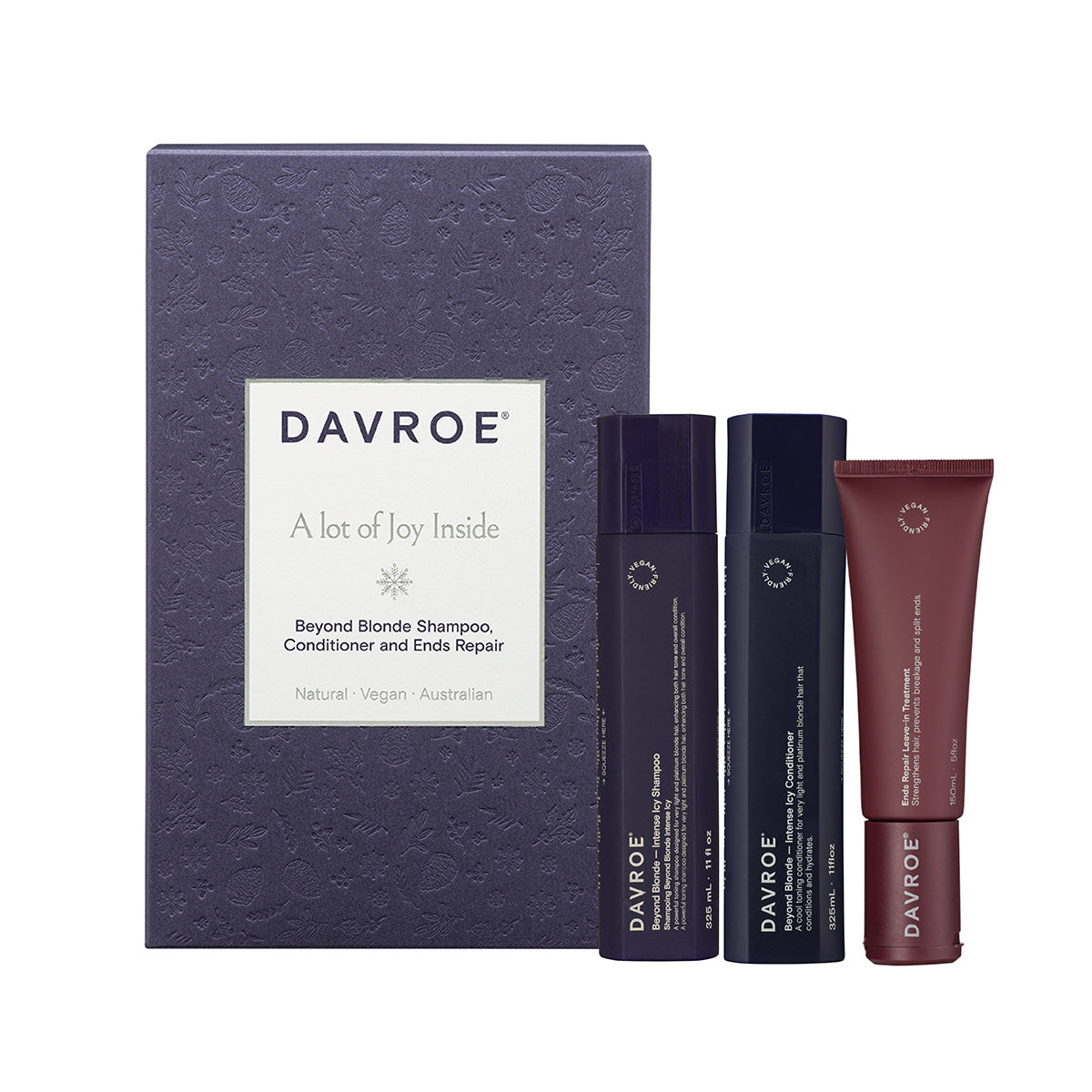Davroe hair care trio pack: two dark bottles and one red tube in a navy gift box