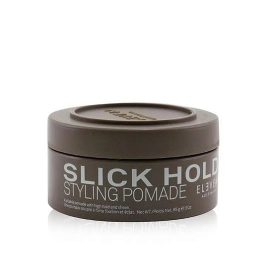 Styling pomade jar with screw-top lid, dark gray container labeled "SLICK HOLD"