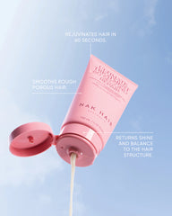 Hair repair treatment tube pouring white cream from open cap