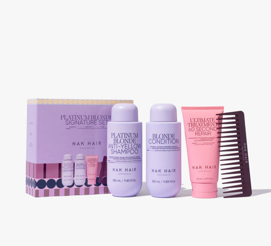 Platinum blonde hair care trio pack with shampoo and conditioner bottles, plus brush