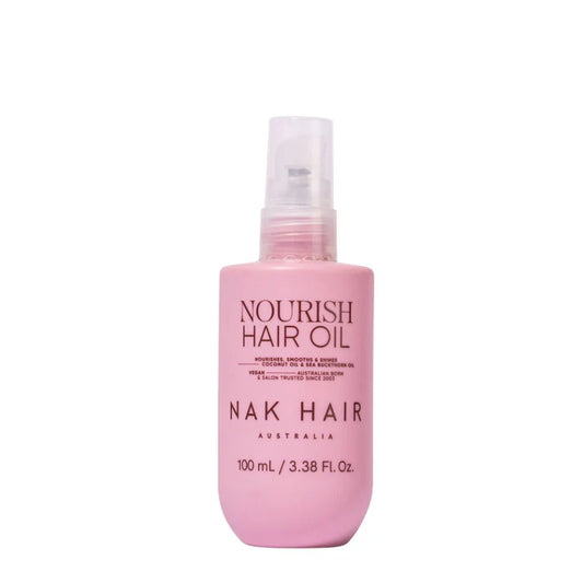 NAK Nourish Hair Oil 100 ml bottle with pink liquid and clear pump