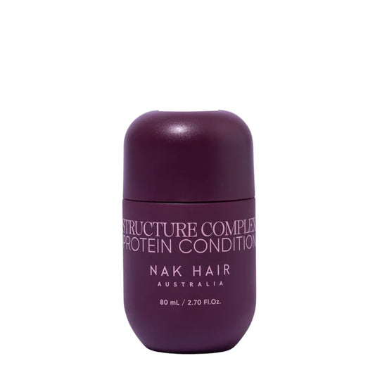 Travel-size hair conditioner bottle, dark purple, with flip-top cap.
