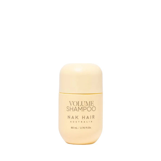 NAK Hair Volume Shampoo travel-size bottle, 80 ml, beige cap and label