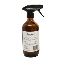 Natural disinfecting spray bottle with amber glass, black trigger sprayer, back label