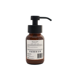 Foaming soap dispenser bottle with amber liquid and black pump, barcode and ingredient label