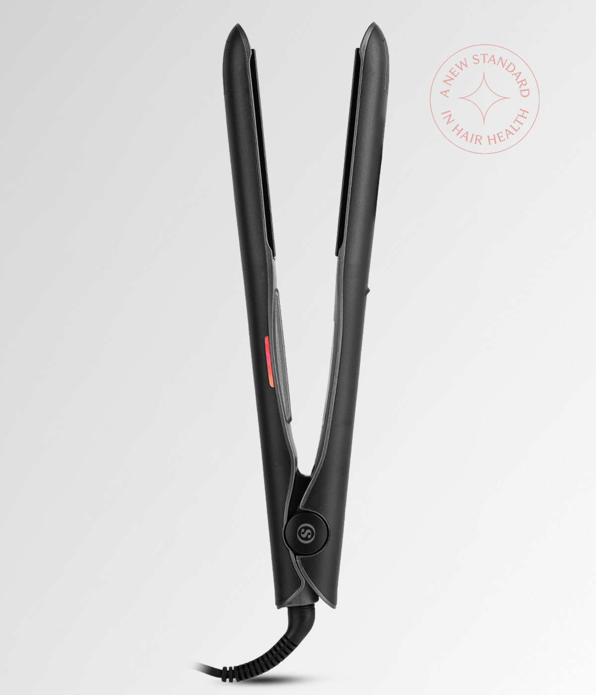 Black hair straightener opened to show heating plates and hinge area