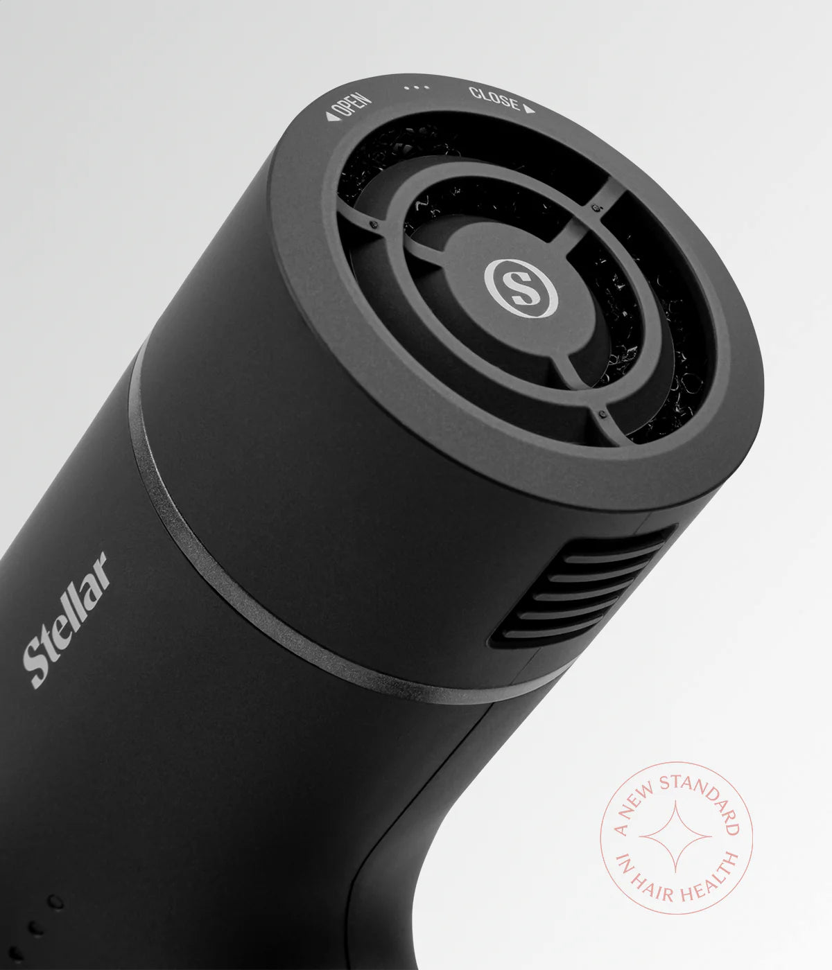 Black hair dryer rear inlet with circular fan grille and side air vents