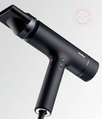 Black hair dryer with angled concentrator nozzle and air vents