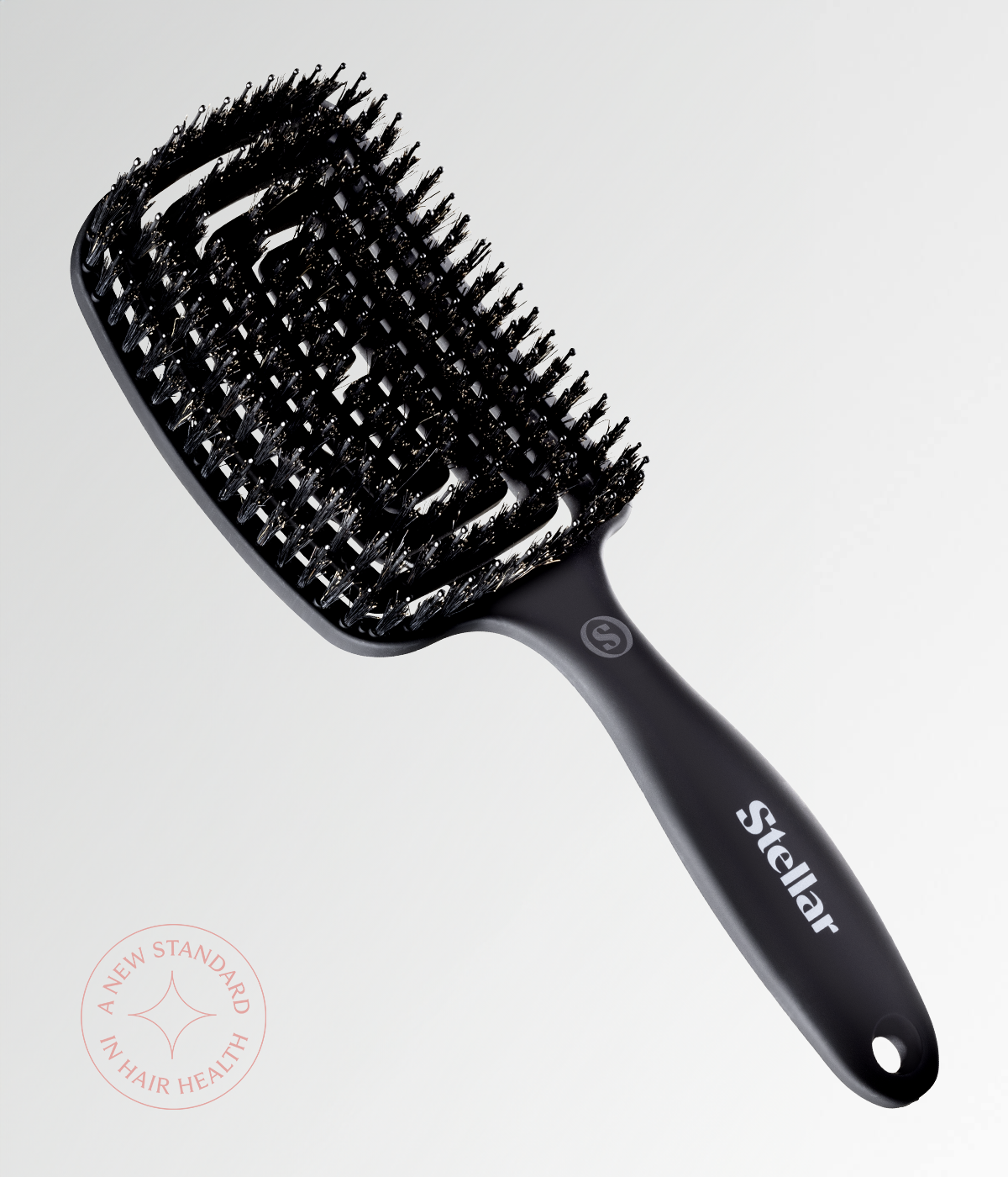 Black vent brush with dense bristles and ergonomic grip handle