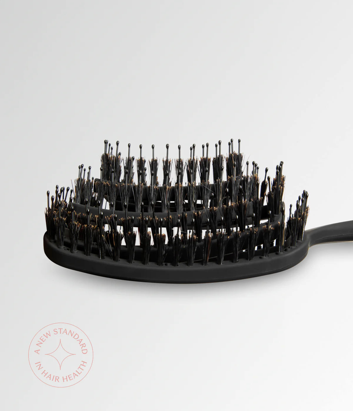 Black round vent brush head with densely packed bristles