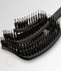 Black vent brush showing multi-row bristles on curved base