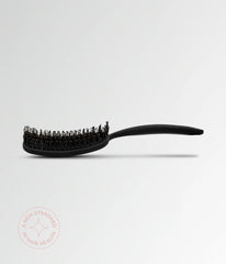 Black vent brush with rounded head and short bristles, extended handle