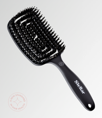 Black vent brush with dense bristles and ergonomic grip handle