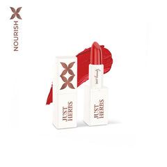 Mini herb-enriched lipstick in deep red, shown in white tube and boxed packaging